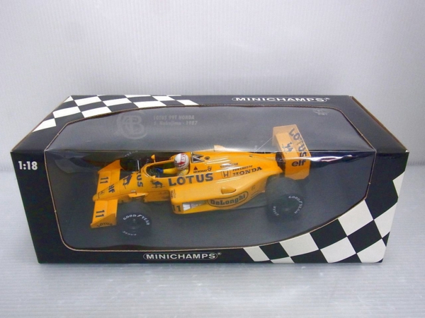 PMA|ミニチャンプス 1/18 ロータス ホンダ 99T/S.Nakajima 1987の画像。中の黄色い車体が見える。